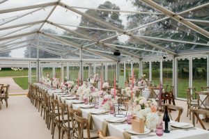 clear marquee. long tables. crossback chairs